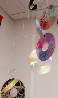 Several colorful CDs hang from the ceiling.