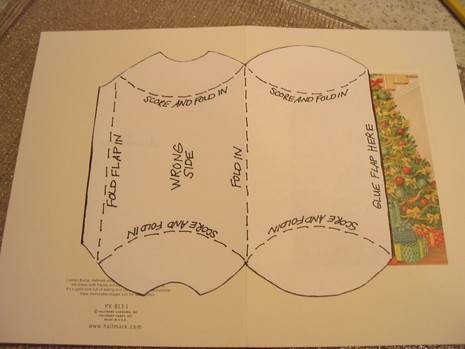 Directions for folding a pop up Christmas card are displayed.
