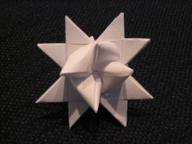 A white folded paper star.