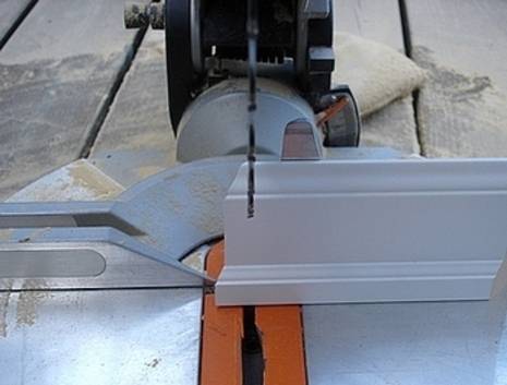 A table saw with sawdust on it.