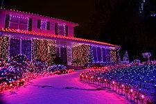 A house with bright christmas lights at night