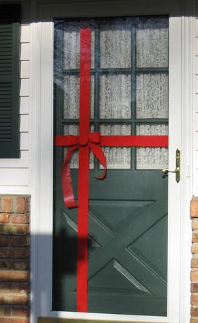 Gift wrapped green color door for Christmas decoration.