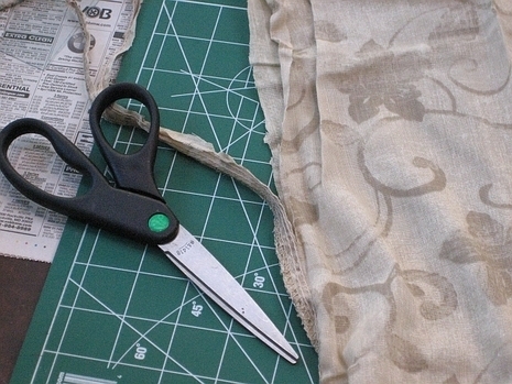 cutting the seam to open up the pillowcase