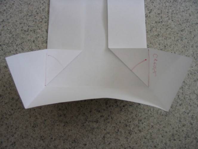 A piece of paper being folded to make a CD case