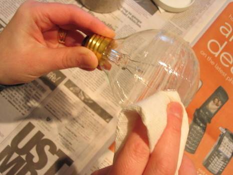 Clear caulk and sand is being used to create a sanded lightbulb for an interesting display.