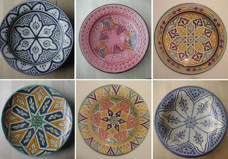 Six decorative plates of various colors and prints decorated in a Moroccan style.