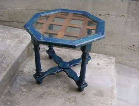 Vintage octagon-shaped small table that is painted blue.