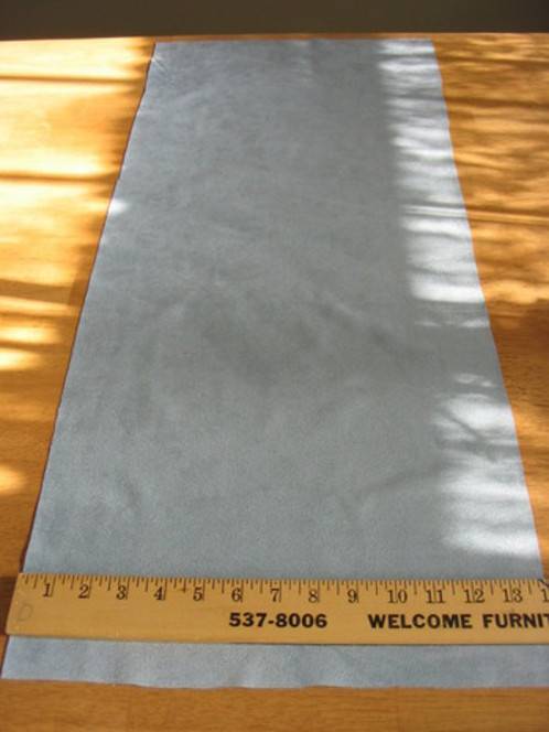 A ruler measuring a piece of fabric 14" in width.