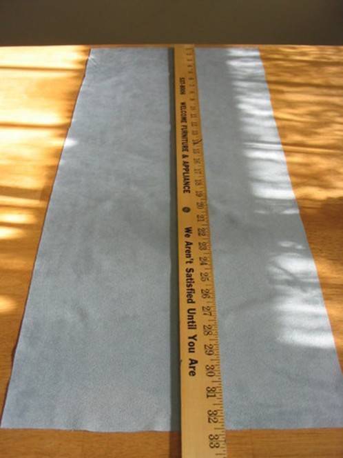 "A measuring scale with a Cloth spread on the table"