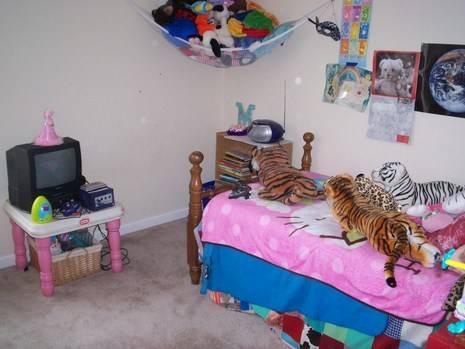"A small and clean kids room with Toys"