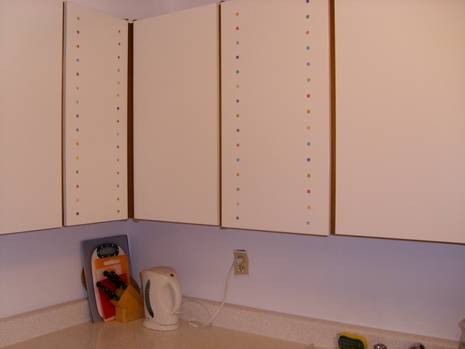 White cabinets are hanging bare.