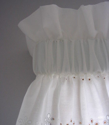 "A White and Simple Pocketed Window Topper for Window"