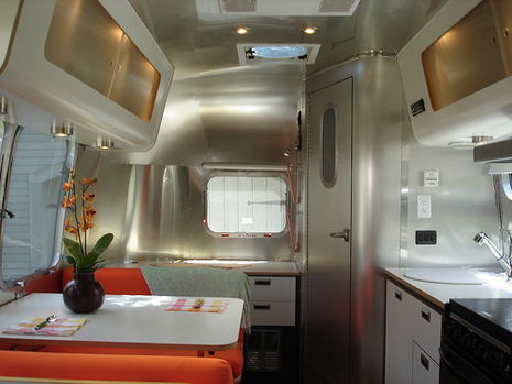 The interior of a mobile home has upgraded furnishings.