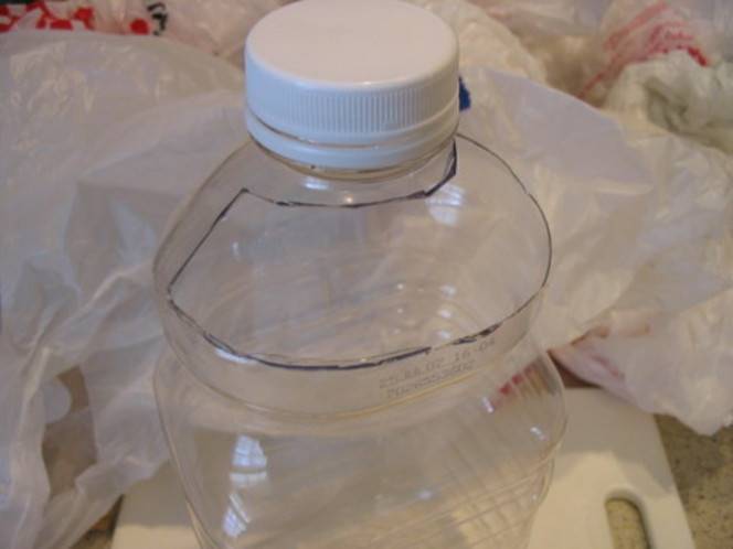 A plastic water bottle which helps to store plastic bags.