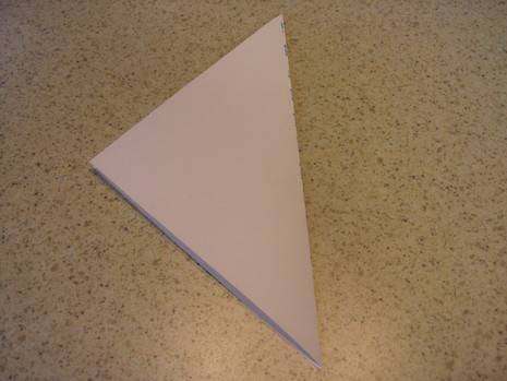 A piece of paper folded into a triangle.