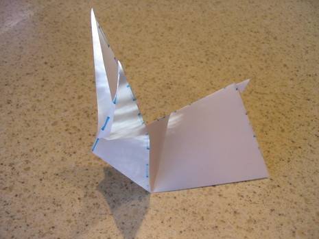 A piece of paper folded up in an origami pattern.