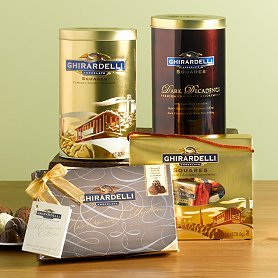 Tins and boxes of chocolates displayed on a table.