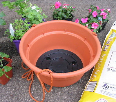 First step of 'how to make an upside down tomato planter'