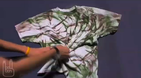 Woman rolling shirt for dyeing