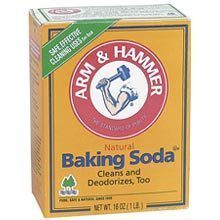 A yellow box of Arm & Hammer baking soda against a white background.