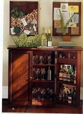 A cabinet full of wine glass and beer bottles and corks.