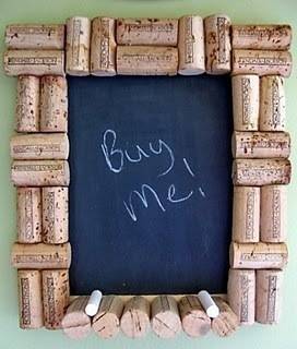 Wine corks form a decorative frame and chalk ledge for a gray chalkboard reading "Buy Me!"
