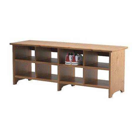 A shoe shelf with a pair of shoes in it