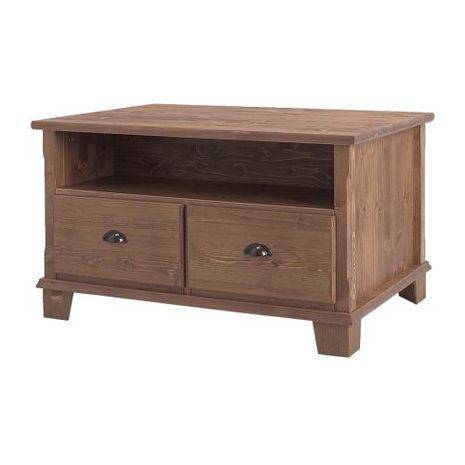 A wooden coffee table or TV bench with two drawers in the front.
