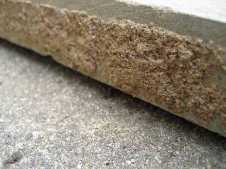 A close up view of the side of cut concrete.
