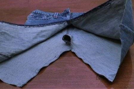 Denim jeans that have been cut short and sewn to turn into a skirt.