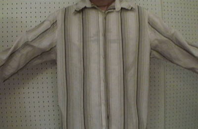 A striped shirt has outstretched arms.