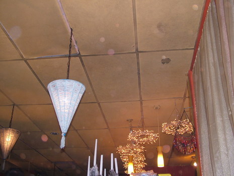 An umbrella hanging from the ceiling of a room.