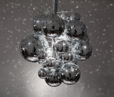 Mirrored balls of different sizes placed together to create a chandelier.