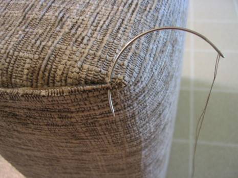 The basket make using curved upholstery needles.