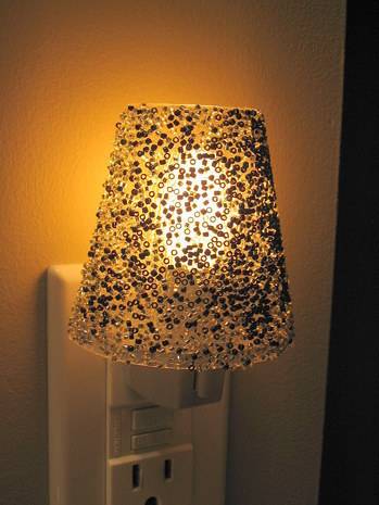 Lamp made with black and white beads on clear caulk.