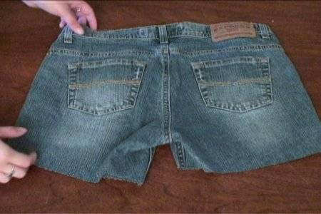 A the backside of a pair of jeans that has been cut into shorts.