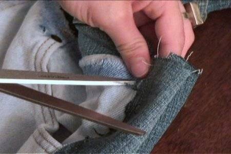 A man is cutting a cloth.