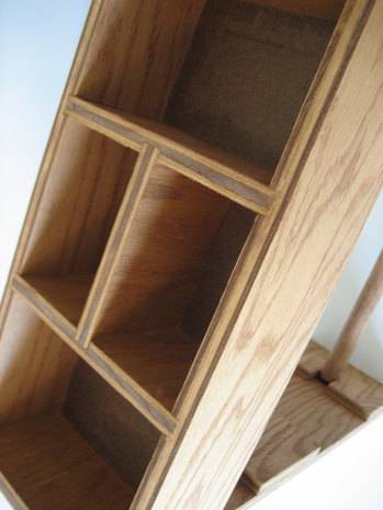 A beer unfinished cabinet with two middle drawers.