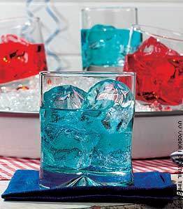 Drinking glasses that have colored ice and liquid inside in hues of blue and red.