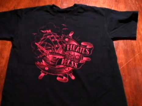 " A black teshirt is placed on the floor ".