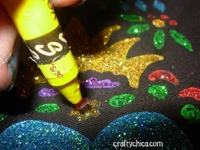 A person making crafts with glitter gum.