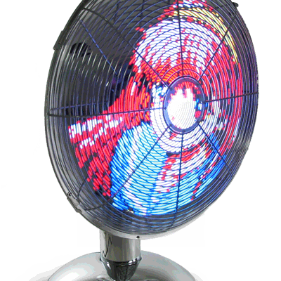 A colourful fan is on the floor.