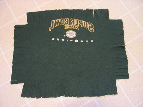A green cloth with the green bay packers logo and the word super bowl on it.