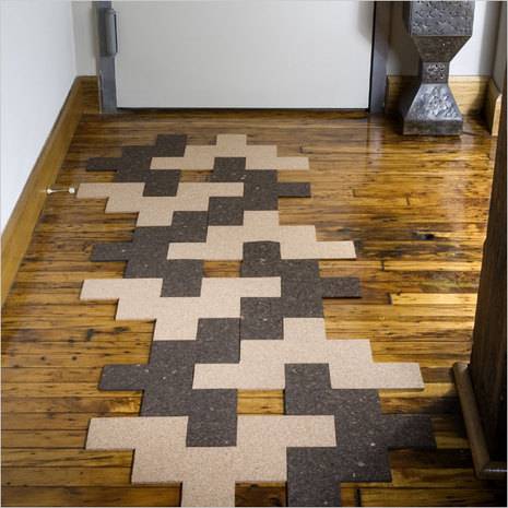 Tiles are arranged on the wooden floor.