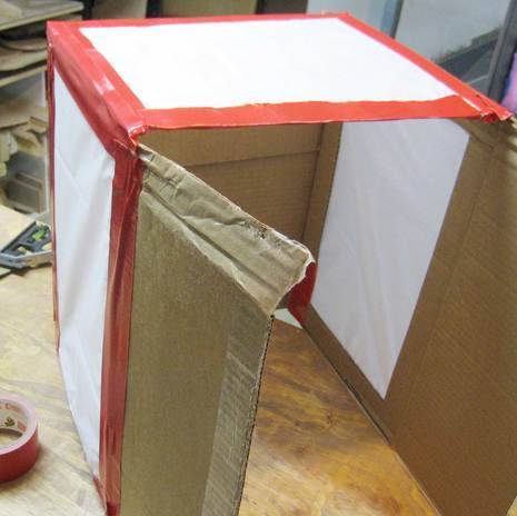 Light box for digital photography is covering with a red colour tape.