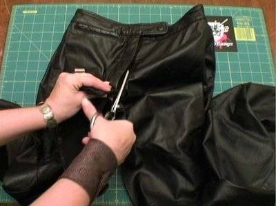 A black color fabric is used for the demonstration to make a girl pirate costume.