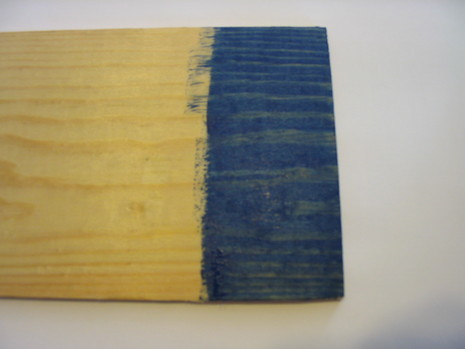 The end of a piece of wood is blue.