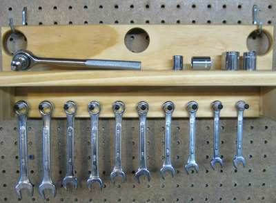 Some screw drivers are arranging in a stand.