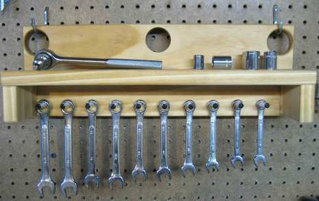 Some screw drivers are arranging in a stand.