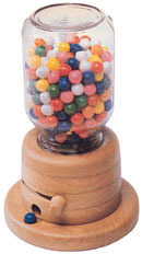 A wooden gumball machine is filled with candy.